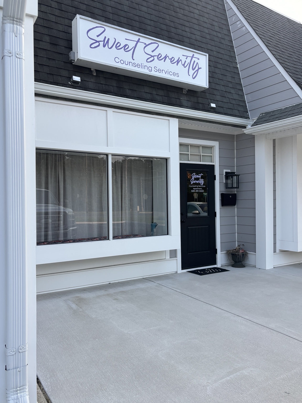 The Sweet Serenity Counseling Services office entrance with its purple sign